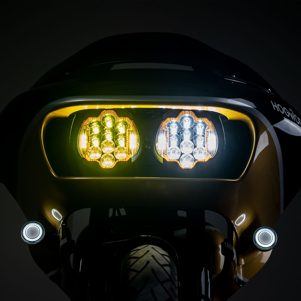 Lit in a shark-nose fairing, front view - HOGWORKZ Sabertooth Performance LED Headlight HW167010