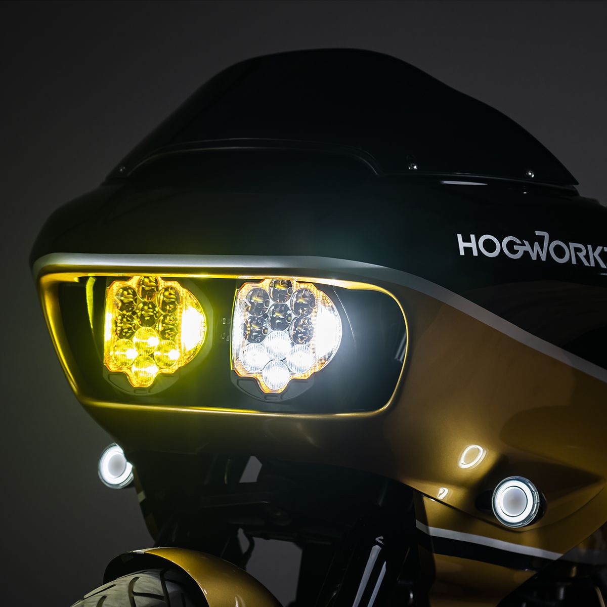 Lit amber and white, low front view - HOGWORKZ Sabertooth Performance LED Headlight HW167010